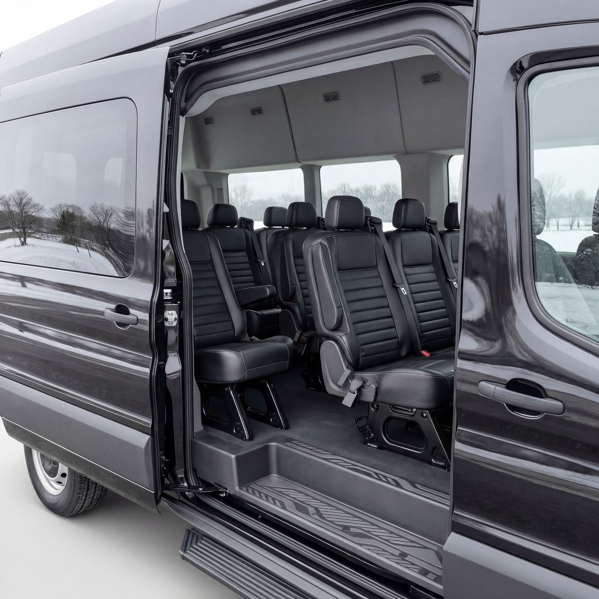 Dark gray passenger van with open sliding door revealing black interior seats.