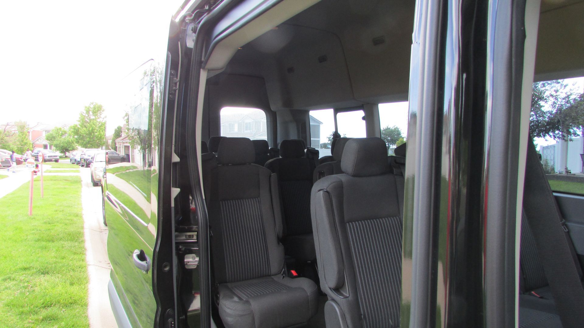 The inside of a black van with the door open.