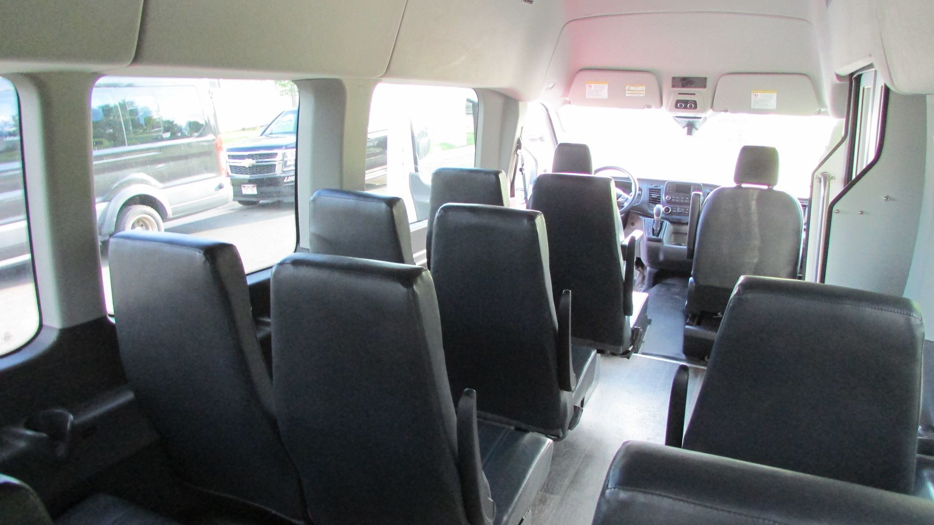 The inside of a bus with a lot of seats