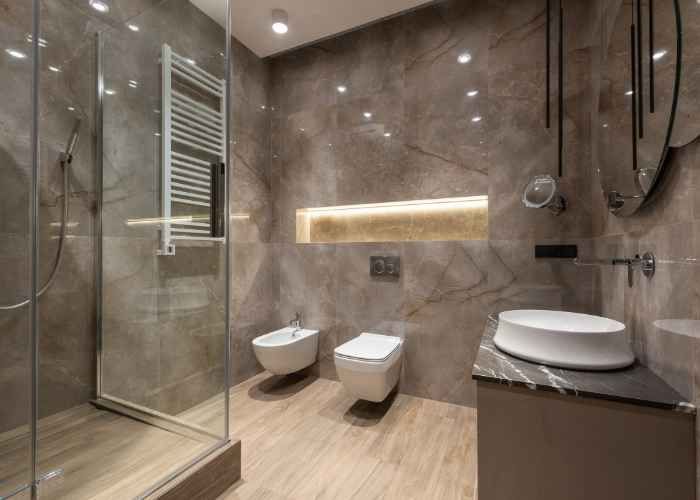 A modern bathroom boasts a sophisticated design with neutral tones and sleek fixtures.