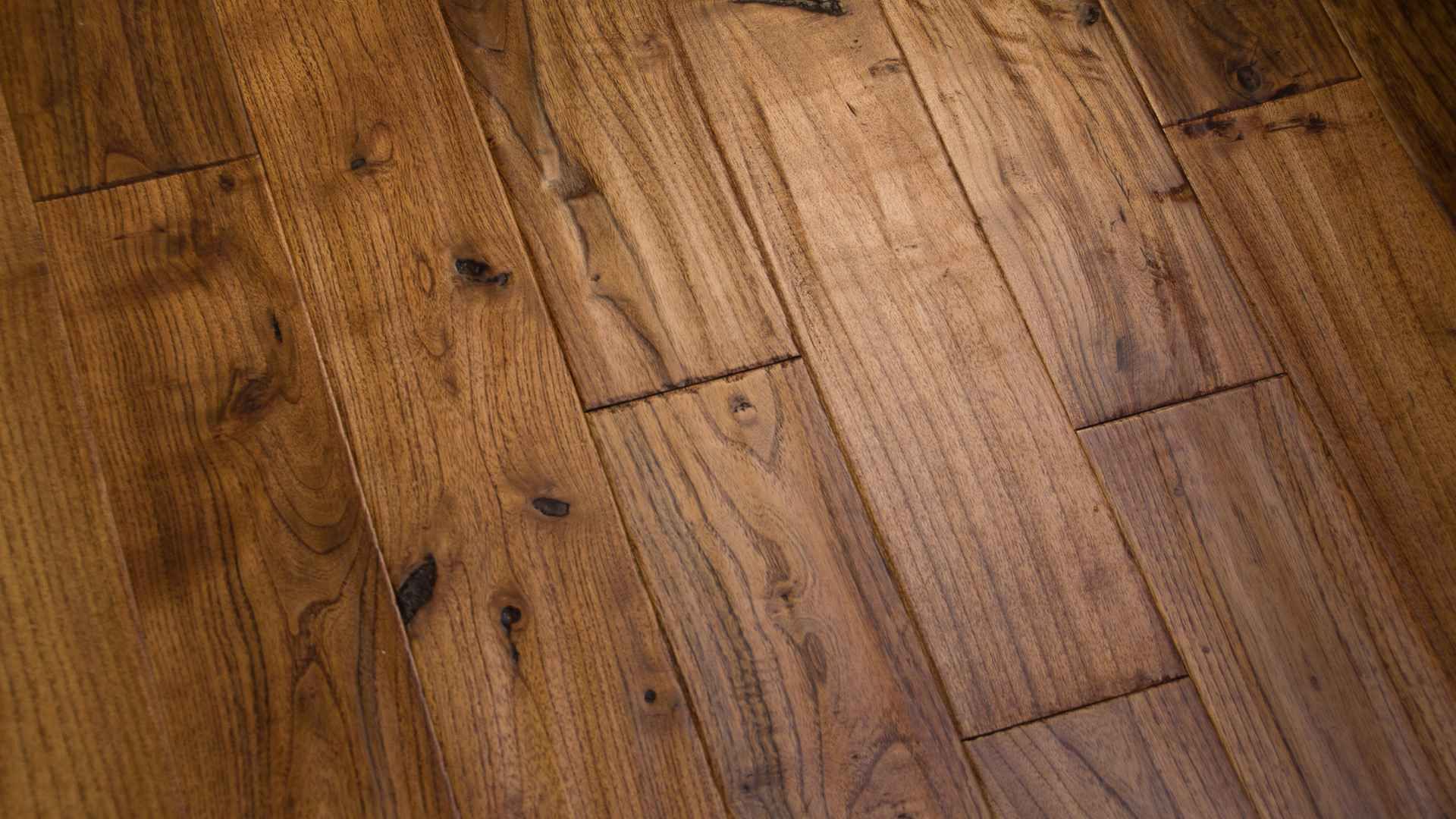 Close-up view of a wooden floor with various shades of brown.
