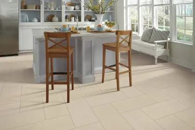 A kitchen with a table and chairs and a bench.