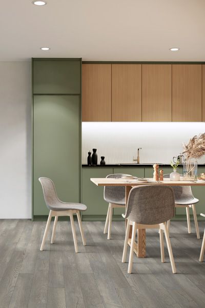 A kitchen with a table and chairs in it.