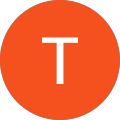 The letter t is in an orange circle on a white background.