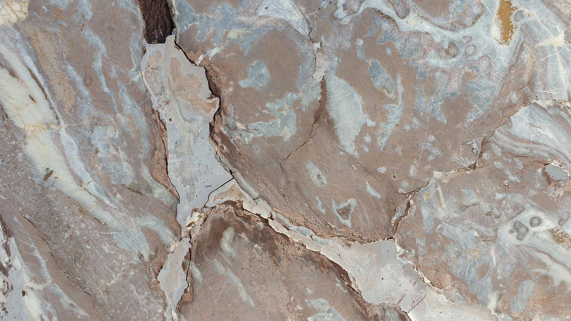 A close up of a brown and white marble texture.