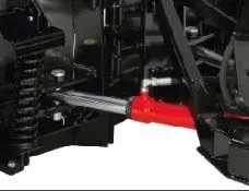 Red hydraulic cylinder on a black machine, likely a plow or heavy equipment.