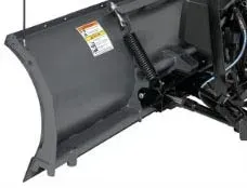 Gray snow plow blade with spring and hydraulic components attached.