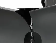 A close-up of a jet's landing gear between two wings, with dark detailing.