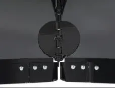 Black metal agricultural equipment, possibly a cutter or blade assembly.