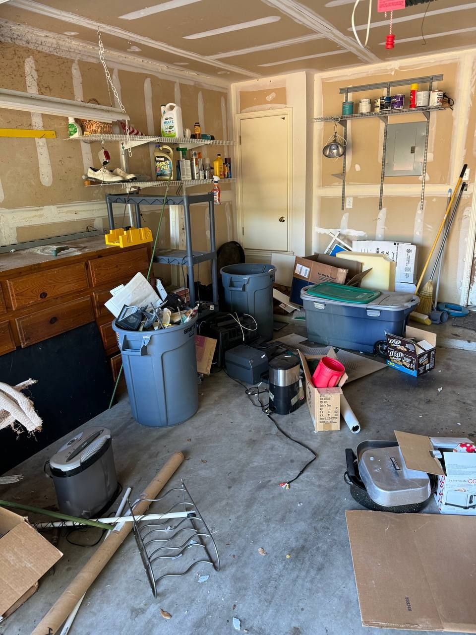 A garage filled with lots of junk and tools