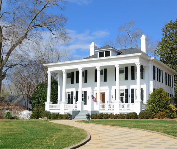 Historic White House with American Flag — Gainesville, FL — Gainesville Pest Control LLC