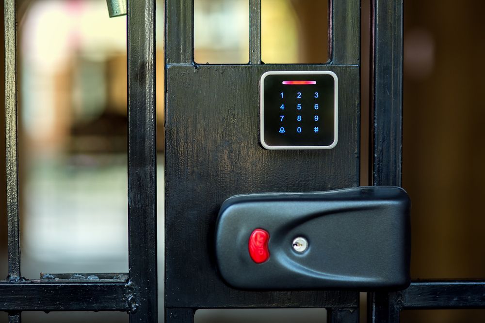 Black Metal Gate With a Keypad and Lock — Gate-O-Matic in Garbutt, QLD