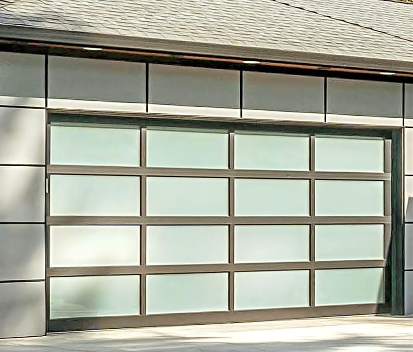 A yellow garage door is on the side of a building.