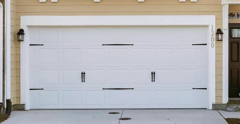 Clean white long-panel garage door with windows installed by Sonny & Sons in Arlington.