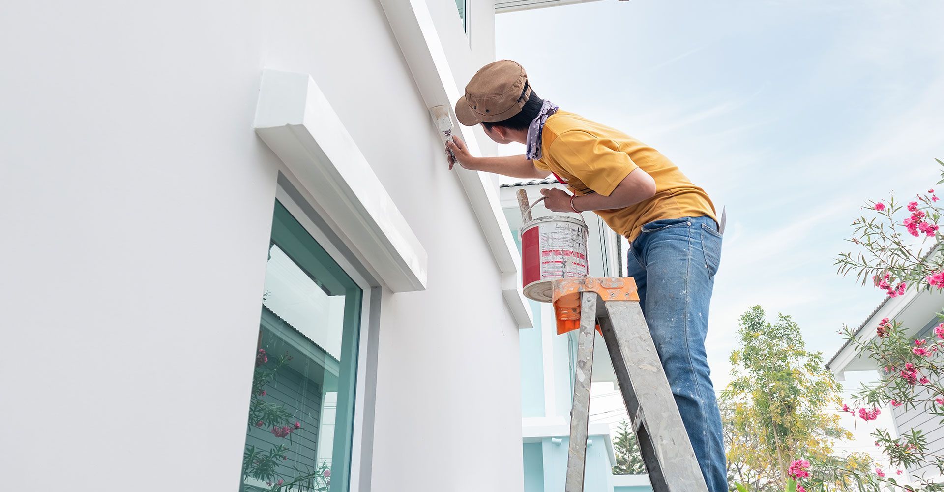 Man Painting the Exteriors of the House
