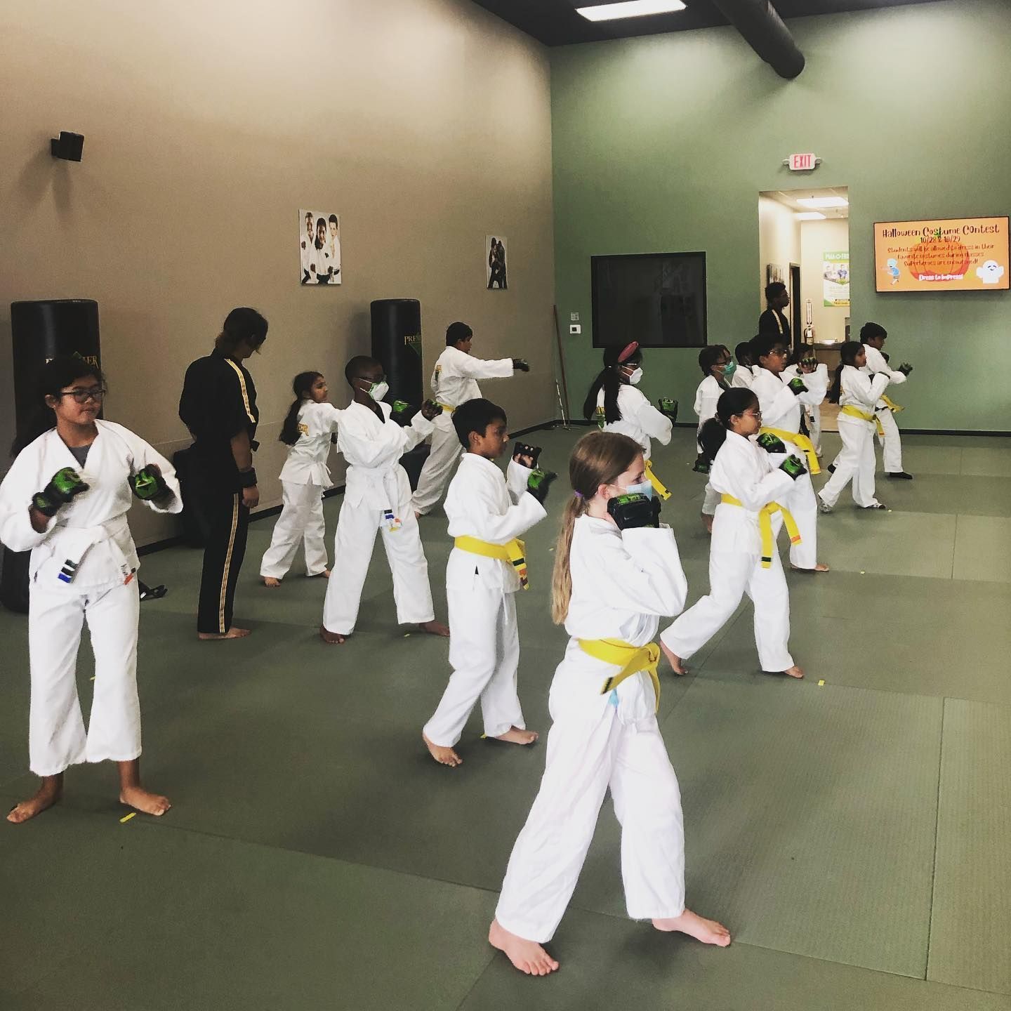 A person is holding a sparkler in their hand in the dark.