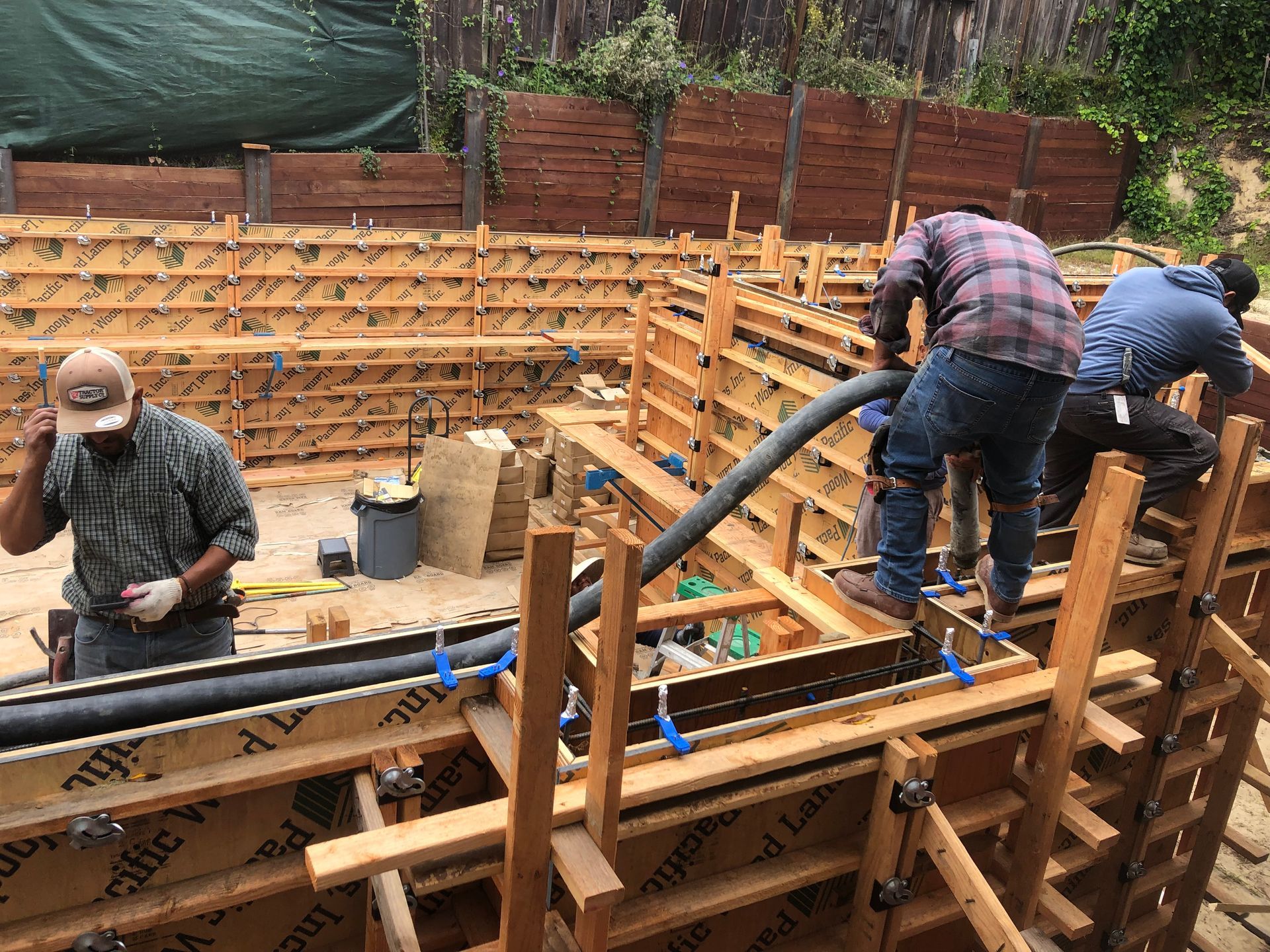 A concrete foundation is being built on a construction site.