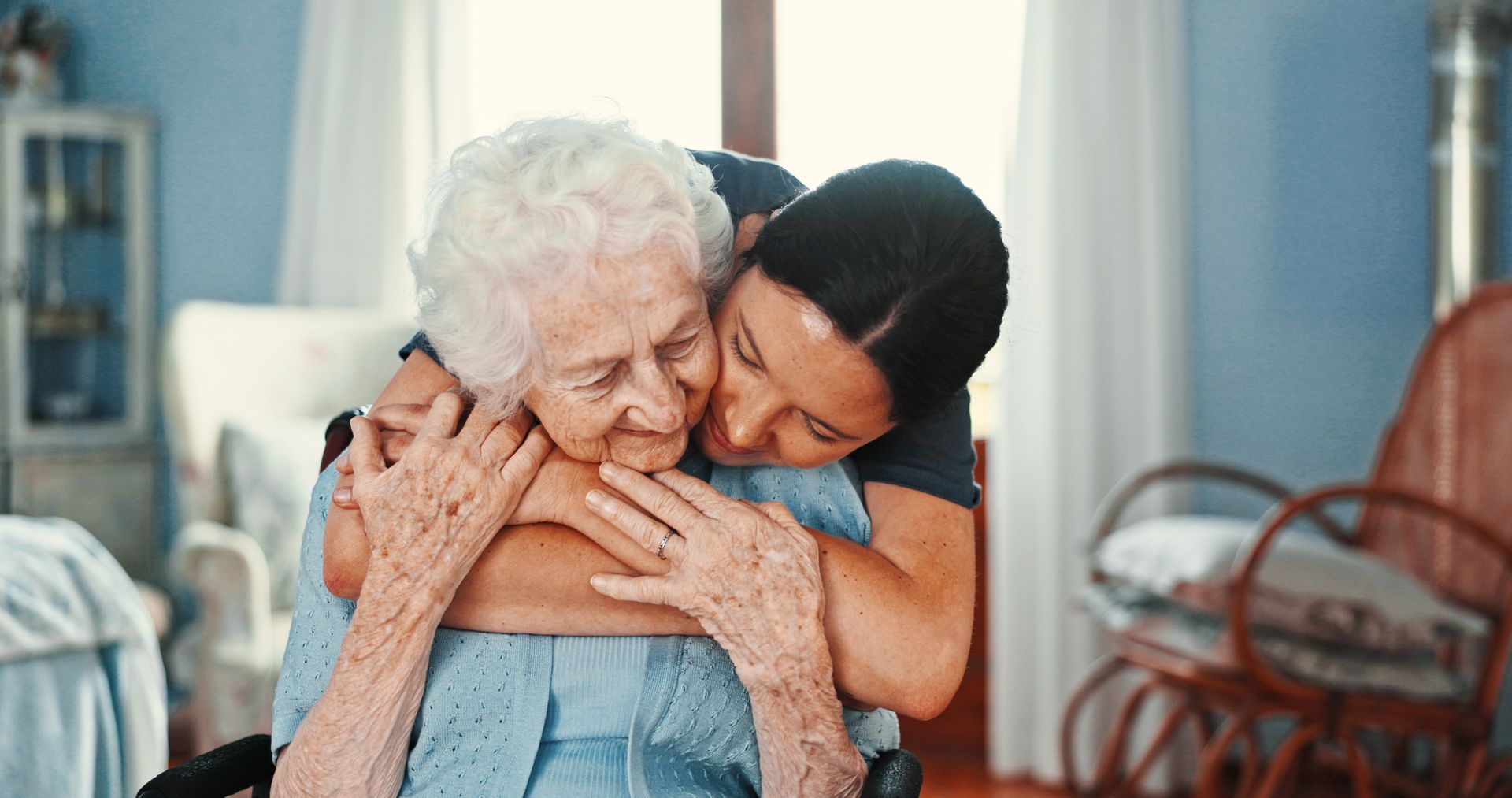 grandmother and granddaughter hugging