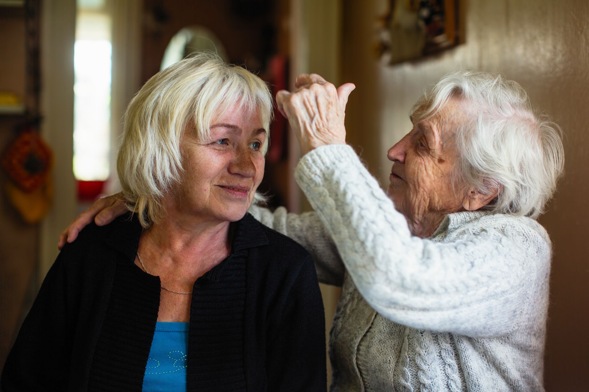 elderly woman fixing hair for video interview with In My Day Films