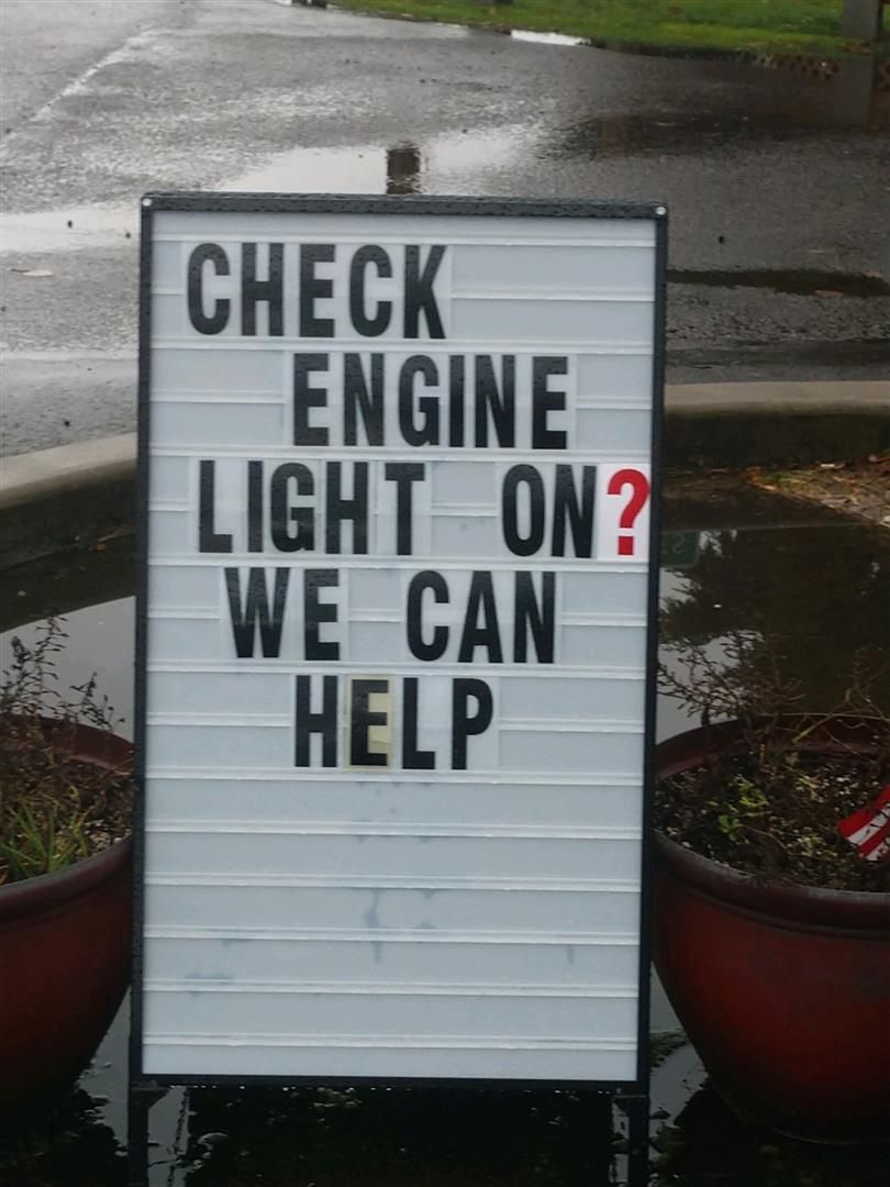 A sign that says check engine light on we can help | J&H Automotive