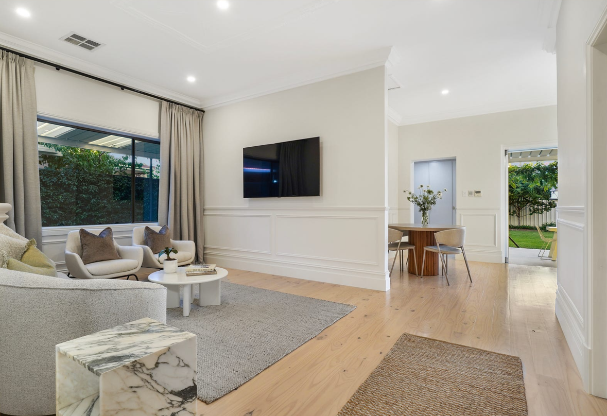 A living room filled with furniture and a flat screen tv.