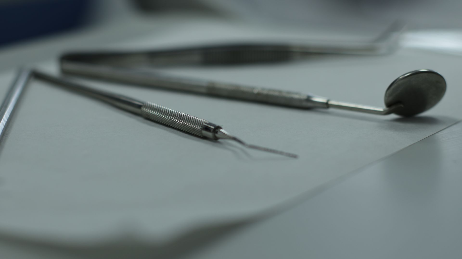 dental instruments are laid out for a patient checkup. 