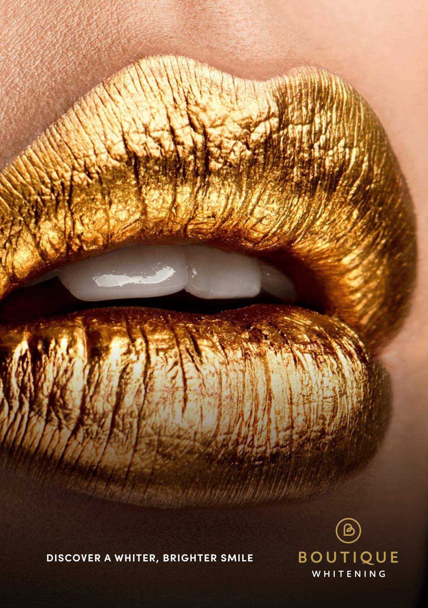 A close up of a woman 's lips with gold lipstick. A white smile. 