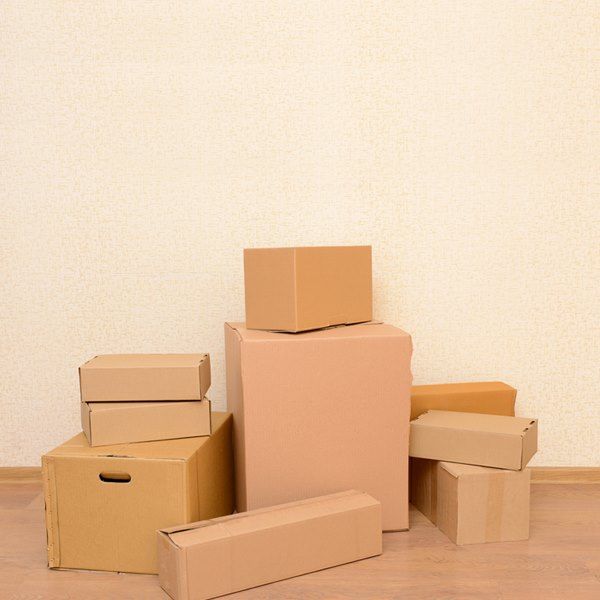 A Bunch of Cardboard Boxes Are Stacked on Top of Each Other — Bondi Removals and Taxi Trucks In Clovelly, NSW