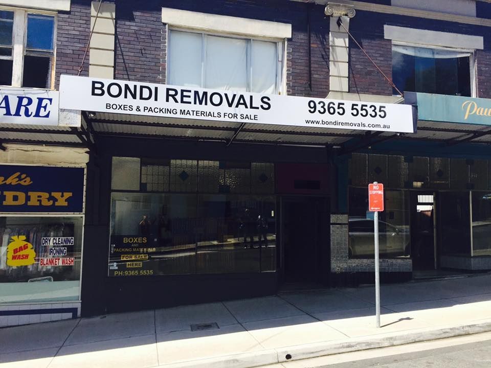 A Building with A Sign that Says Bondi Removals on It — Bondi Removals and Taxi Trucks in Randwick, NSW