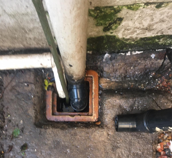 gutter drain being cleared