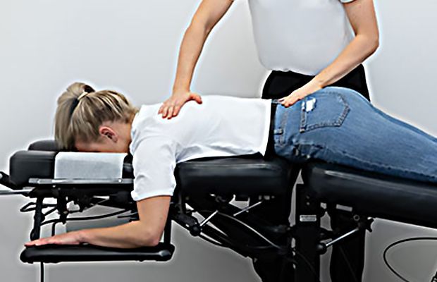 a black and white drawing of a person laying on a table .