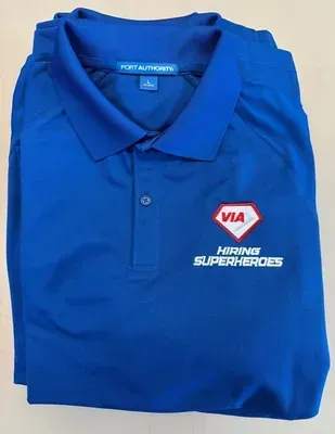 Blue polo shirt with VIA logo,