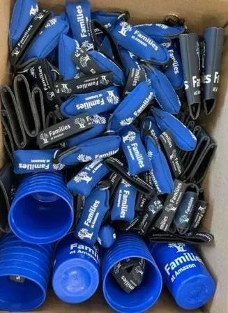 Box of blue and black golf club covers with