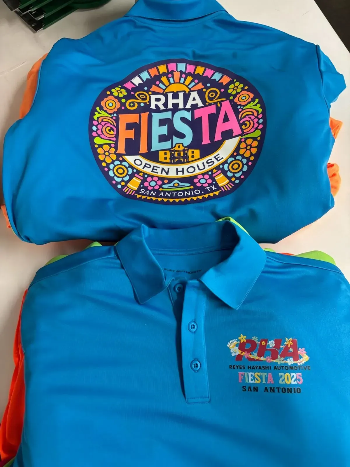 Two blue polo shirts with