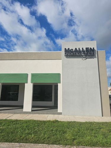 rectangular building with a sign for the funeral home