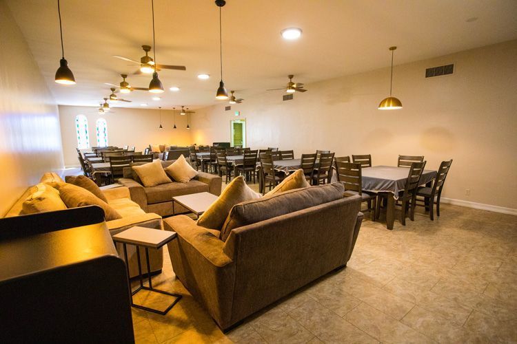 A living room with a lot of furniture and tables