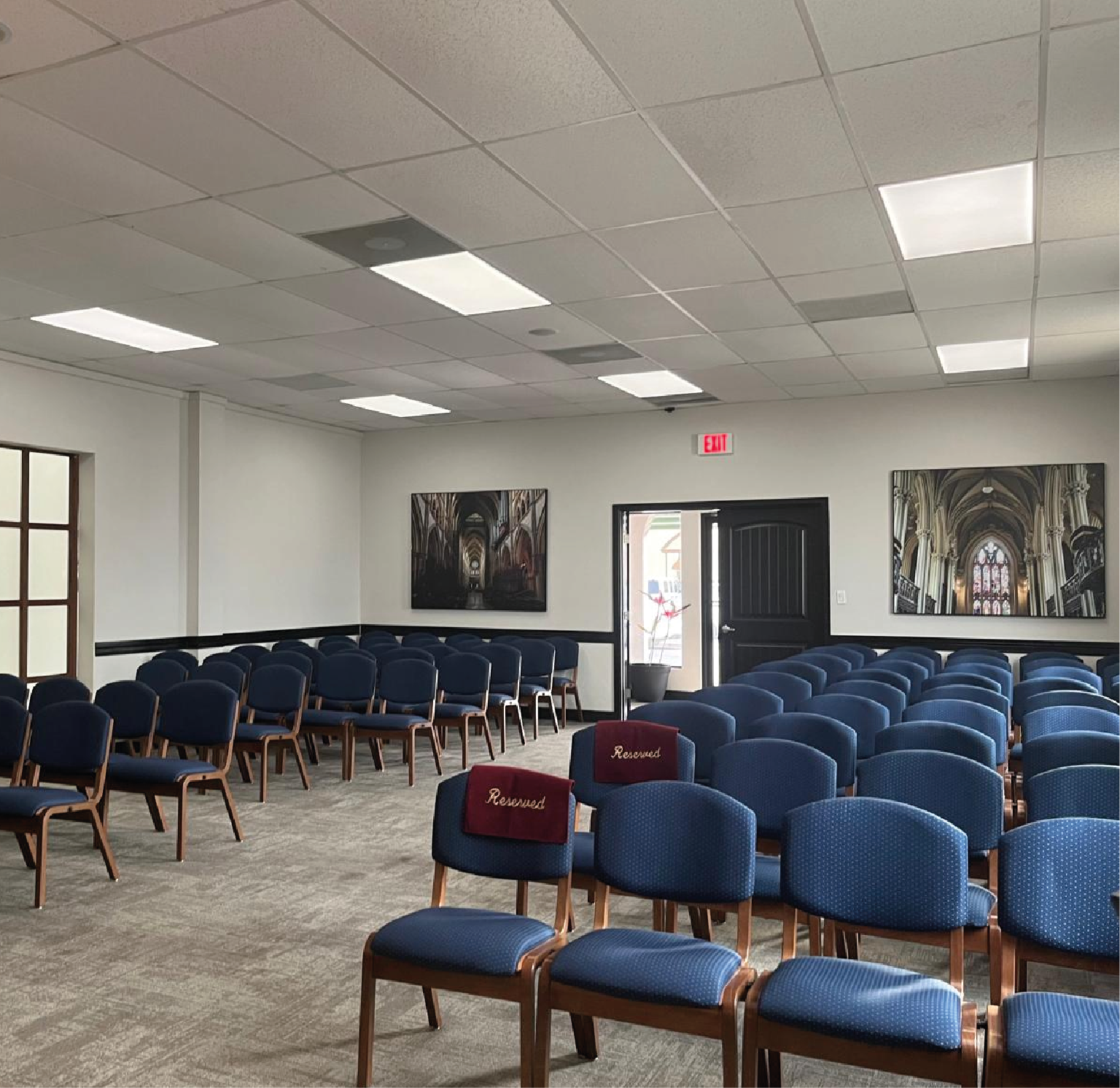 inside chapel with the painting of god and adam touching fingers