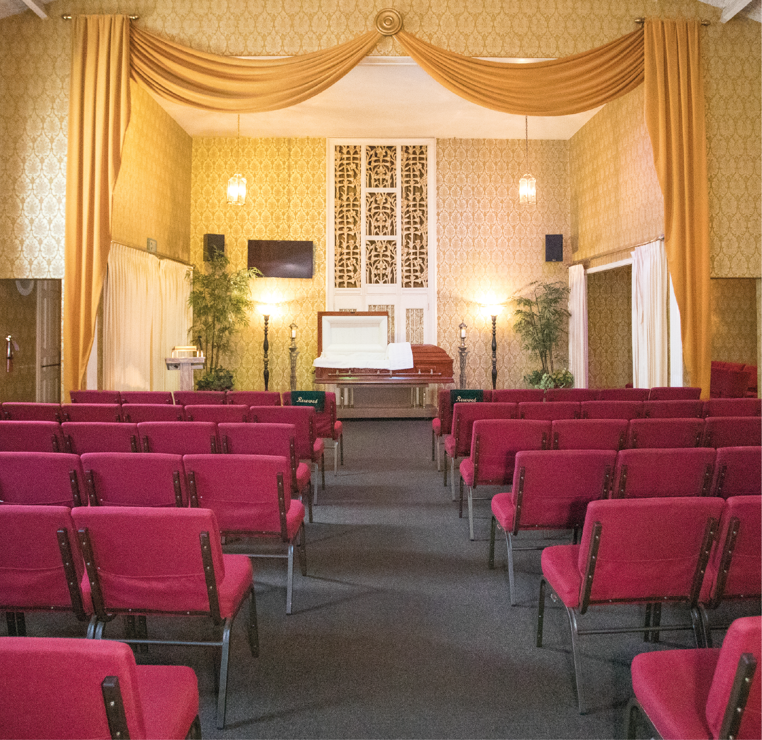inside chapel with the painting of god and adam touching fingers