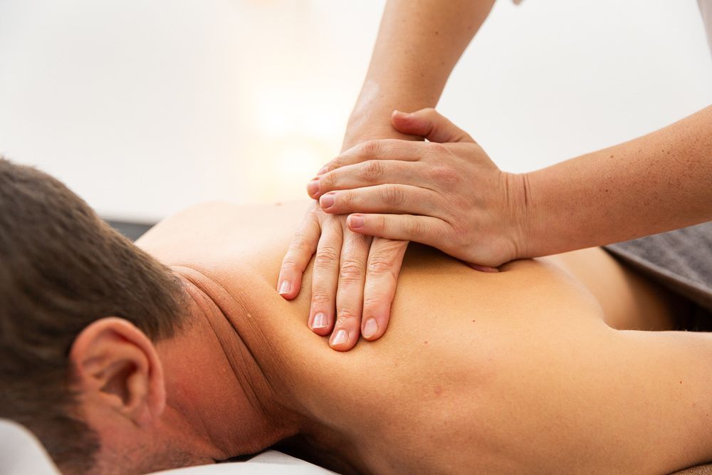 Man Receiving a Therapeutic Back Massage