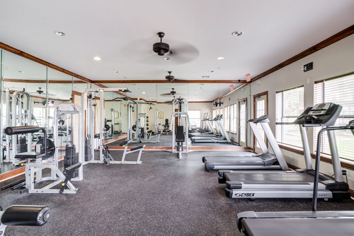 Bay Vista apartment exterior view with seating area and beautiful pool view.