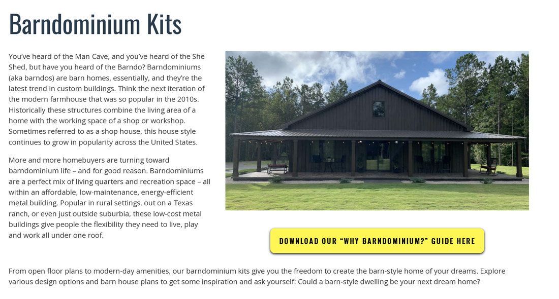 A picture of a barn with a porch and trees in the background.