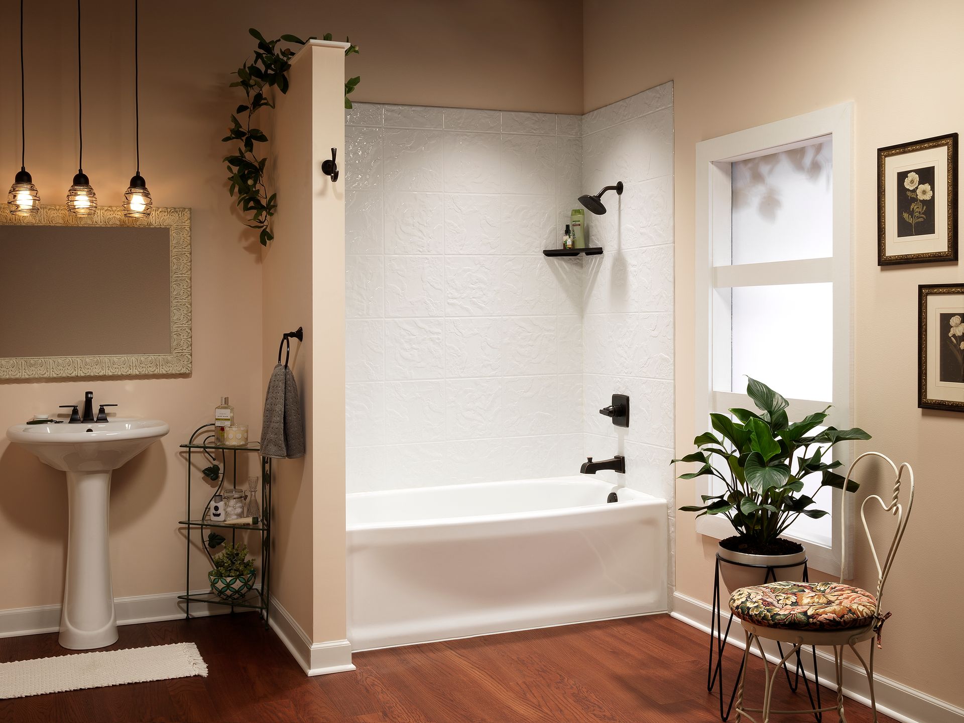 A bathroom with a tub , sink , mirror and chair.