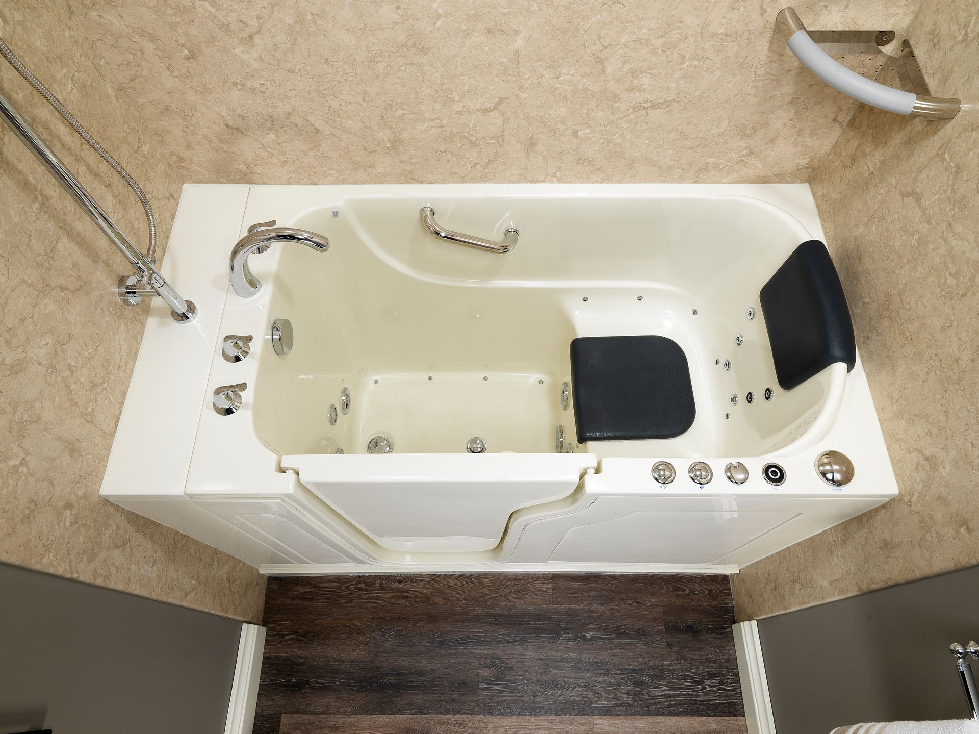 An aerial view of a walk in tub in a bathroom.