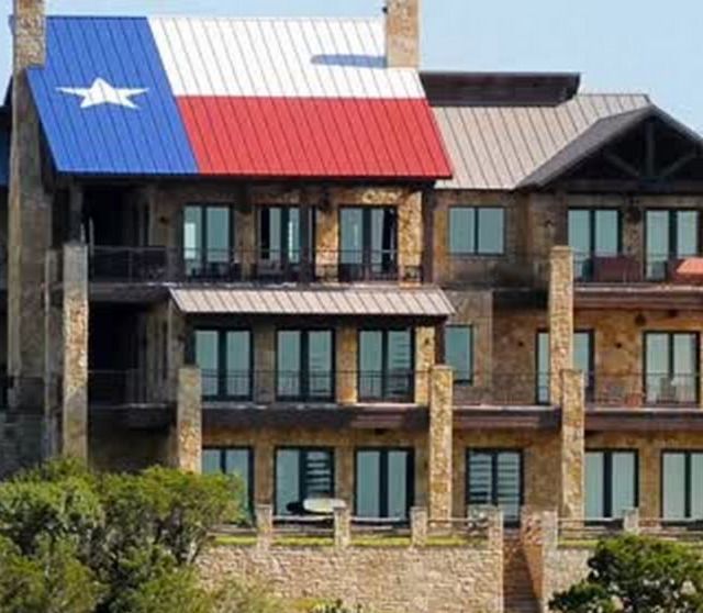 A person is cleaning a window with a squeegee.