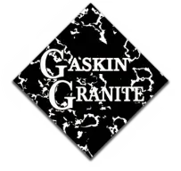 Gaskin Granite logo on a black marble diamond with white lettering