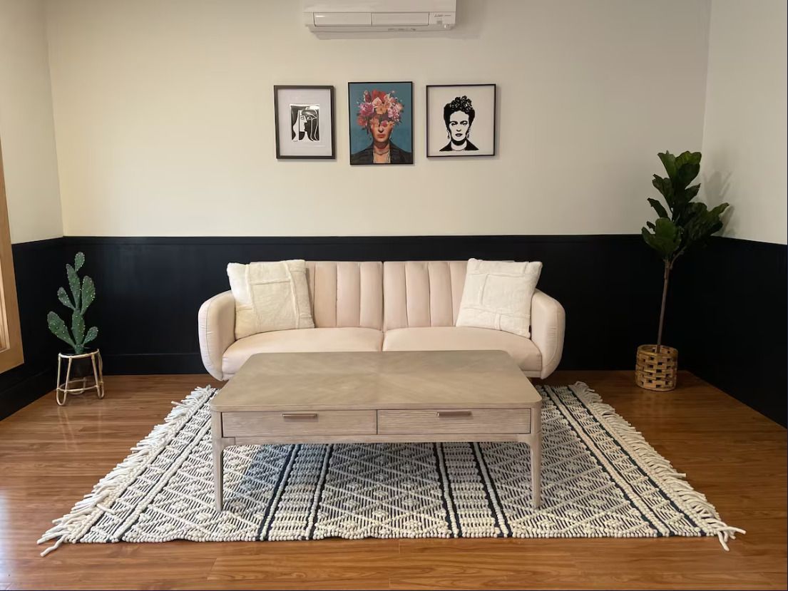 A bedroom with a king size bed and a flat screen tv.