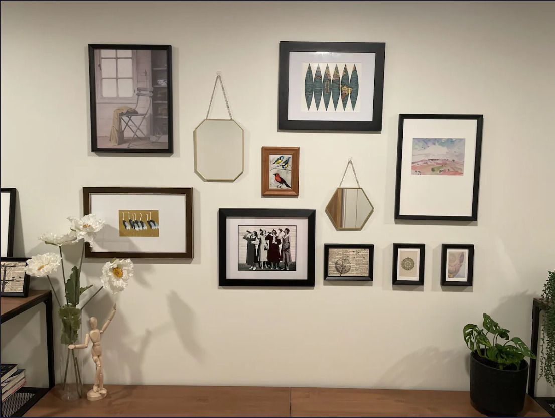 A wall with a bunch of pictures on it