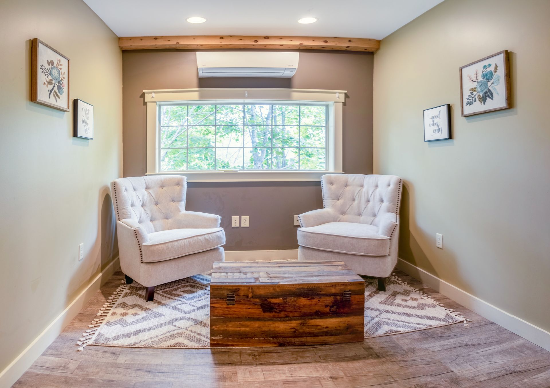 A living room with two chairs and a coffee table.