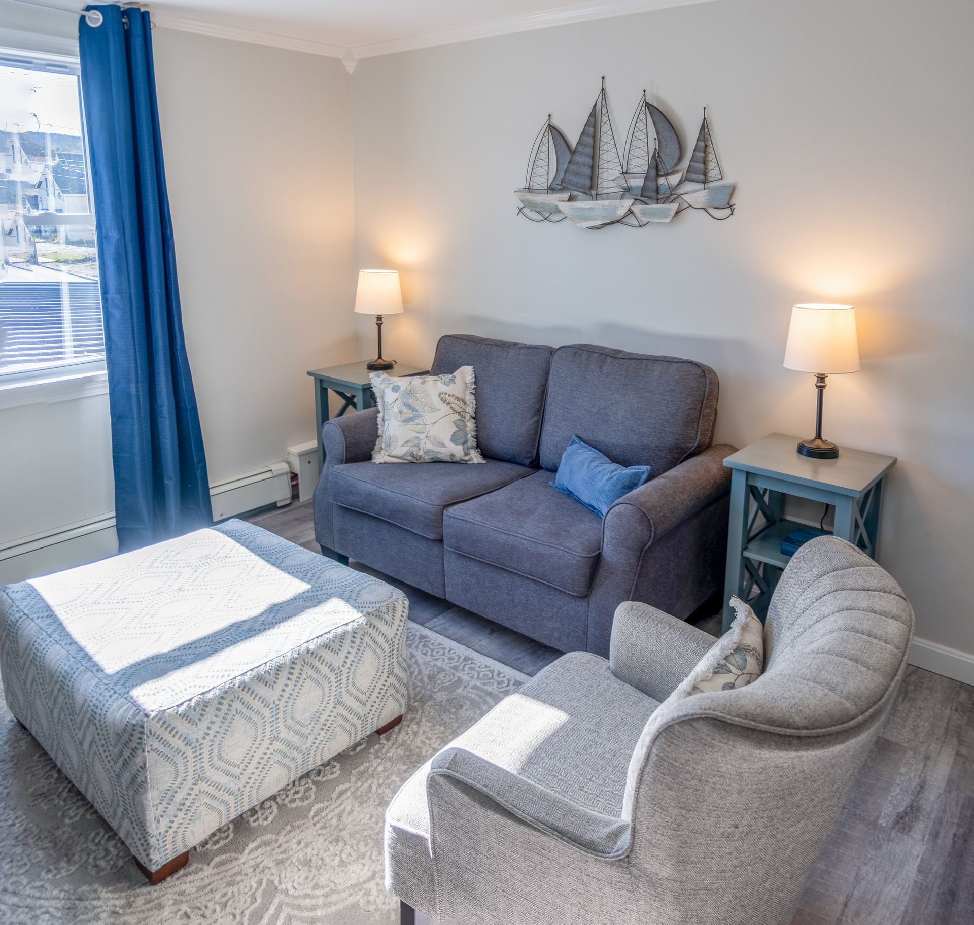 A living room with a couch a chair and a coffee table