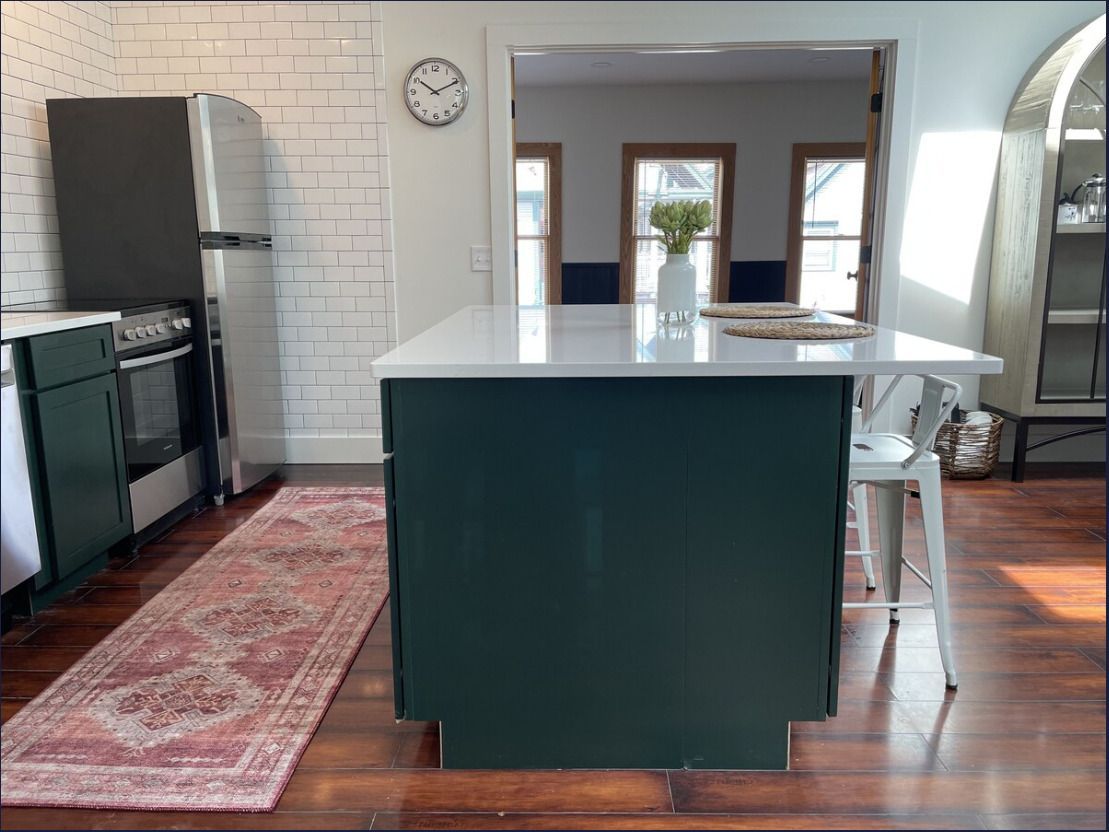 A bathroom with a toilet and a shower stall